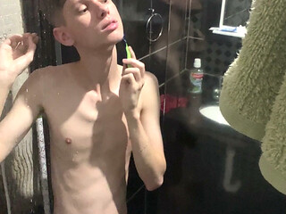 A Twink showing his body and naked at shower