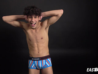 Curly twink boy shows off his slim body on webcam