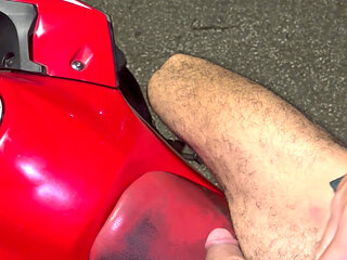 Big, beautiful penis of a Brazilian model on a motorcycle without underwear, showing it off in public.