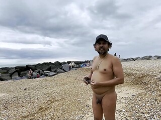guy walking nude in beach