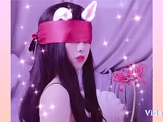 Asian girl bound by a scarf in BDSM scene