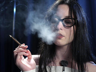 Smoking Seduction - Intriguing Lady in White. 2 Black Cigarette in a Row.