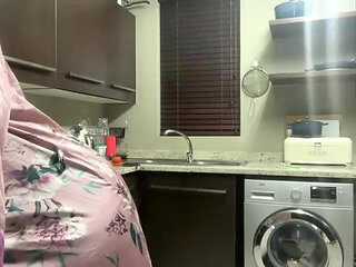 Ebony MILF Moaning and Stripteasing in Kitchen
