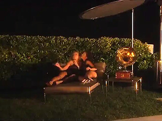 Adorable MILFs share horny kisses with their man in a steamy poolside tryst