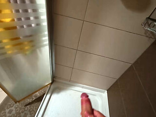 After fucking in the shower she kneels for a facial load