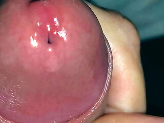 Very close-up of an over-excited penis and streams of pre-cum!