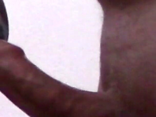 Close-up of a MILF Sucking a Cock and Taking a Load in Her Mouth.