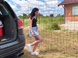 Sexy brunette opens her legs and pee on the ground