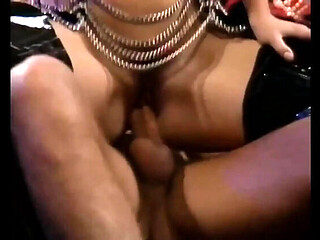 Rocco Siffredi's big dick drilling a sexy blonde milf in a classic retro scene