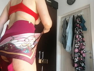 Amateur wife has fun trying on clothes and cutting them. Amateur wife vacuuming naked in the house.