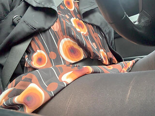 Elegant stepmom drives to the office wearing tights and a beautiful dress