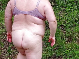 neighbor undressed in a public park and masturbates her pussy
