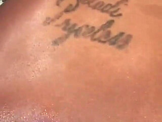 Megan Pryce an ebony slut with tattooed skin and brunette hair fucks with a bbc pounding her pussy