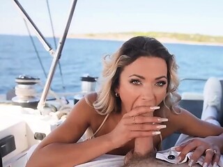 Busty babe gives a deep blowjob to his meaty prick on the