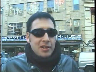 Hot dominatrix in leather with a great body puts a guy in clamps