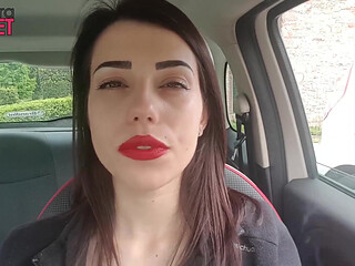Good looking Petra smoking in her car