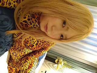 A cross-dressing boy masturbated in leopard print full-body tights, wearing long gloves and knee socks.
