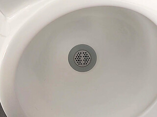 Moaning daddy has a lot of pressure and milks his cock in the public toilet