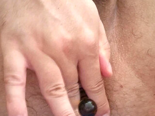 sissy playing with glass dildo until cumming in chasity