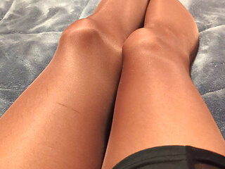 Wearing pantyhose lying in bed