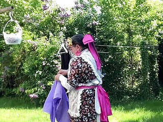 In gardening outfit to hang the laundry outside