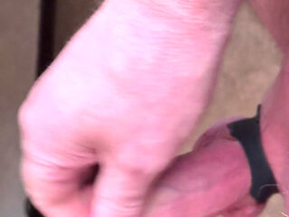 My Friend Sits in a Chair and Jerks His Cock While Watching the Video Until He Orgasms