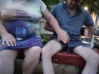 Jerking off my cock in the yard on a bench