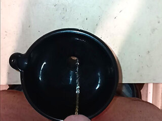Pissing in A Bottle with The Aide of A Funnel