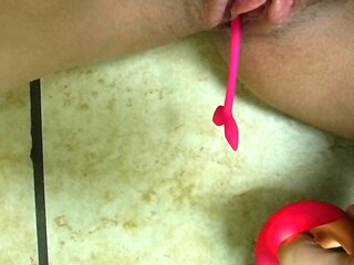 Redhead solo plays with an adult toy at the mall