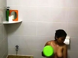 Indonesian maid gets huge tit fucked in shower cam