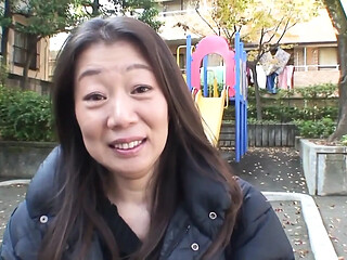 Japanese Cougar enjoys a sensual massage with a lover.
