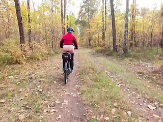 Biking MILF needs to pee and jerk off in the forest