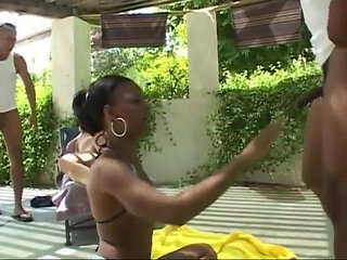 A black and a white sluts are ass fucked by two rough African studs