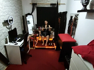 Mistress dominates slave with electric toys and spreader bar