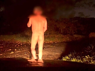 Masturbating naked outside of car , hiding behind a rock when cars pass by