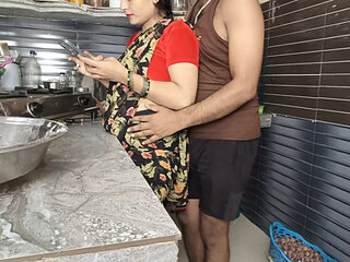 In the kitchen, the brother-in-law caught the sister-in-law from behind while using the mobile, then hard in the bedroom.