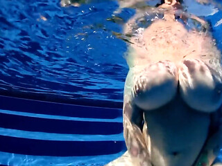 BBW babe shows off huge naturals in the pool underwater POV