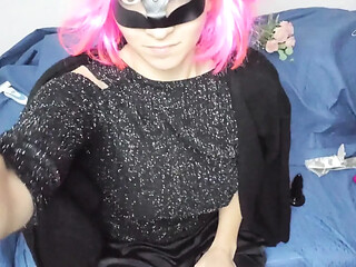 Voluptuous beauty wanks herself with a toy behind a pussy mask