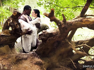 Interracial couple engages in sensual outdoor passion