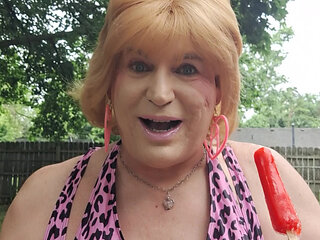 Sucking and enjoying an outside popsicle!