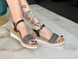 Sandals and Black Toenails Polish on Long Toes