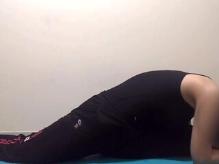 Fit wife stretches after workout and shows off big tits