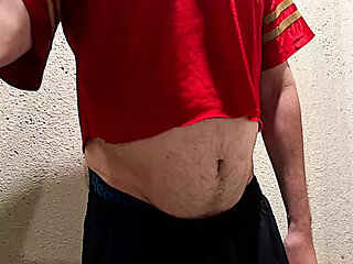 Athlete shows his ball gut and navel