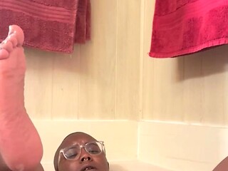 Solo babe enjoys a hot soak in the bathtub