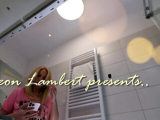 Blonde with natural big tits and ass touches herself in the bathroom