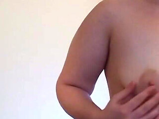 Teen lotions and rubs her tits