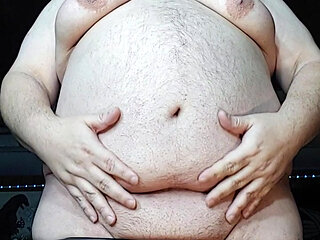 Chubby guy stands and cums