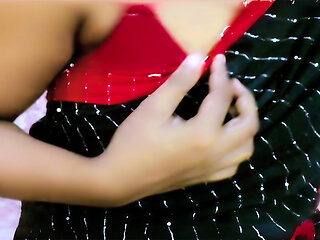 A shy but cute desi girl looks absolutely stunning in her traditional saree, showing off her natural beauty with a teasing and p