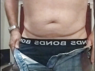 Older guy taking off his jeans and jocks cos he wants to feel his cock in the night air. Shakin' his slackie