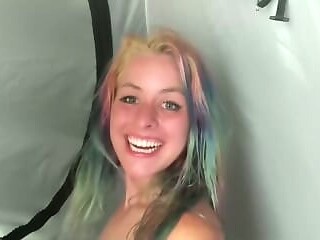 Two hot lesbians explore passion under the tent at a music festival